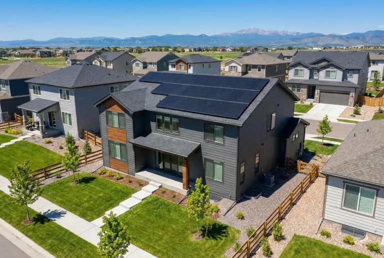 Ariel image taken by a drown of a new custom house with solar panels built and installed in Castle Rock, CO, by Verified Builders.