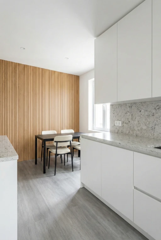 Modern dining area renovation by Verified Builders in Lakewood featuring a vertical wood slat accent wall, white flat-panel kitchen cabinets, and grey quartz countertops.