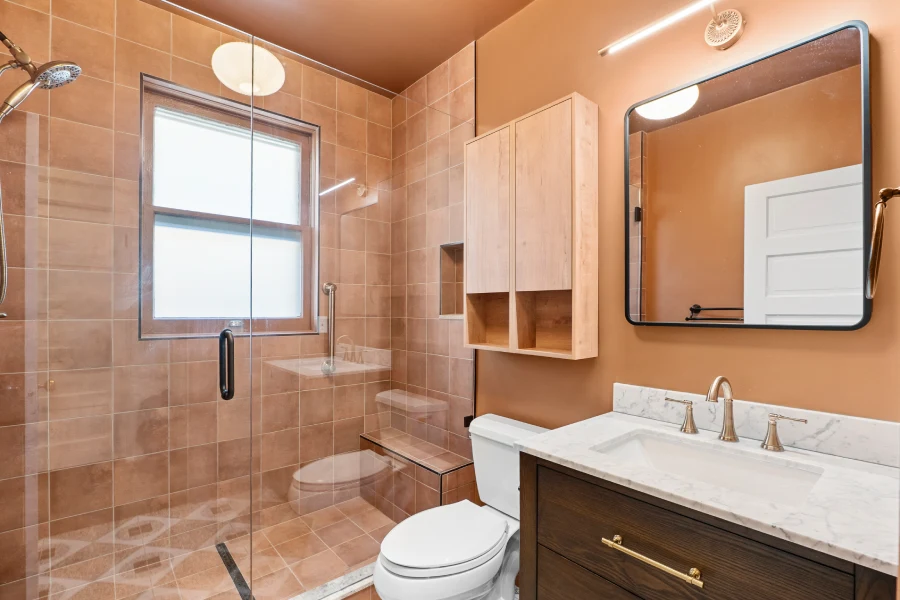 Finished bathroom remodeling in Denver, CO at 1308 York Street, featuring a luxury tub-to-walk-in-shower conversion with custom frameless glass and bold designer tile.