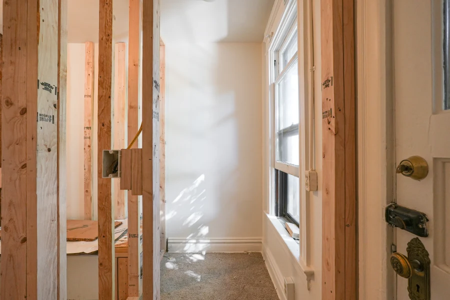 Structural wood framing phase for a new walk-in closet at 1308 York Street, Denver, CO 80206, transforming dead space into a functional master suite storage area.