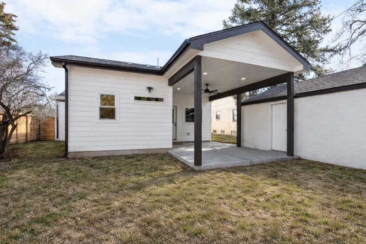 Exterior view of a 425 sq ft primary suite addition featuring a modern covered patio on Holly St in Denver, CO 80220, designed and constructed by Verified Builders.