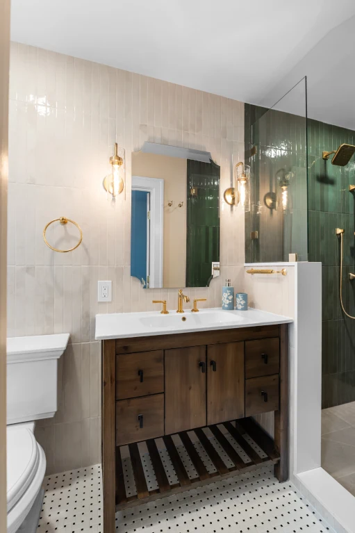 Basketweave matte white and black porcelain mosaic floor with Milk porcelain wainscot in the finished Denver bath.