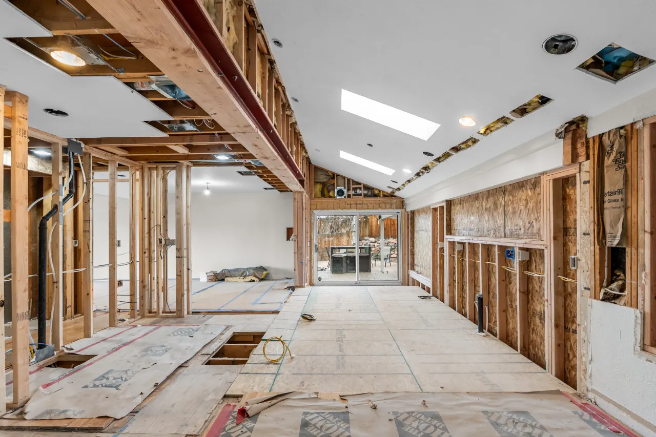 During: the patio floor raised level with the house floor, original skylights kept, window wall reframed